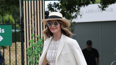 Fashion and makeover expert Trinny Woodall arrives at the All England Lawn Tennis and Croquet Club. GC Images
