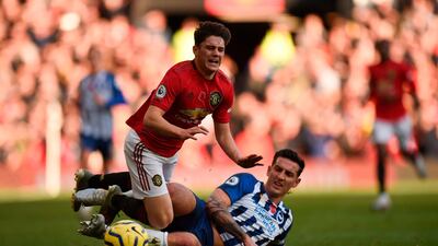 Manchester United midfielder Daniel James, left, is fouled by Brighton's Lewis Dunk during their match at Old Trafford on Sunday. AFP