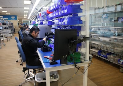 An employee works on the assembly of ventilators at Ventec Life Systems. Reuters
