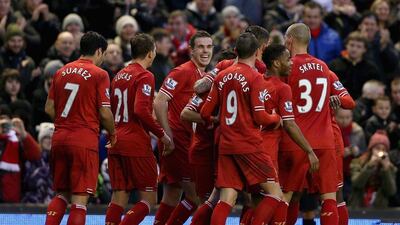 Liverpool's Jordan Henderson and team mates celebrate after Daniel Agger scored the first goal during their Premier League match against Hull City at Anfield on Wednesday. Clive Brunskill/Getty Images