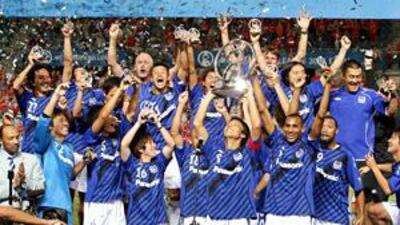 Gamba Osaka's Satoshi Yamaguchi lifts the Asian Champions League trophy after winning the competition last season. They will be among the favourites to defend the title this year.