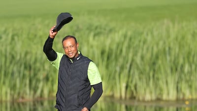 Tiger Woods waves to fans on the 18th green during the JP McManus Pro-Am. AP