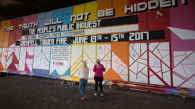 The Truth Wall covered in colourful graffiti artwork. It invites residents to ask and answer questions about Grenfell, its inhabitants and the tragedy that befell them.