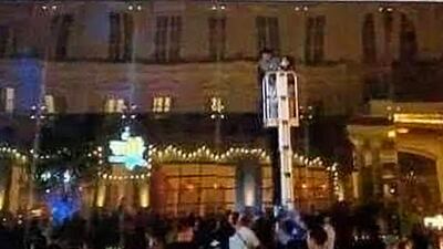 People gather on window ledges to escape the blaze. AFP