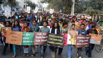 Bangladeshi activists hold placards and march in a protest demanding the scrapping of the proposed Rampal power plant, in Dhaka, Bangladesh, Saturday, January 7, 2017. AP