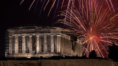 Fireworks explode over the ancient Parthenon temple at the Acropolis hill during New Year celebrations in Athens on January 1, 2023. AP