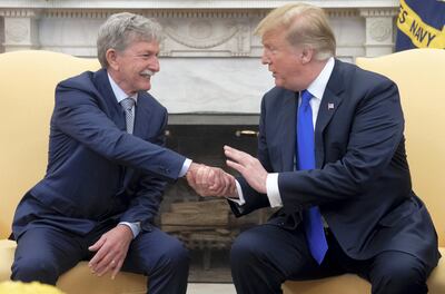 US President Donald Trump shakes hands with Danny Burch, an American who was held hostage in Yemen for 18 months. AFP