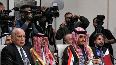 Iraq's Foreign Minister Fuad Hussein, left, and Qatar's Foreign Minister Sheikh Mohammed bin Abdulrahman at a meeting of foreign ministers of the Arab Contact Group on Syria in Aqaba, Jordan. AP