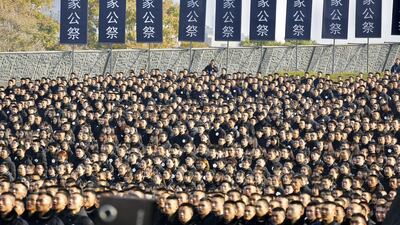 People attend a mourning service at the 1937 Nanjing Massacre Memorial in Nanjing, China. EPA