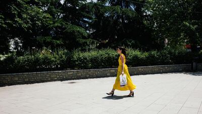 A woman walks through a square in Pristina, Kosovo. Arianna Pagani for The National