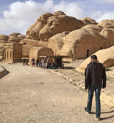 Petra guide and muezzin, Mr M, walking through his hometown. Courtesy Melinda Healy