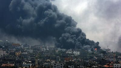 Smoke rises from the Al Shejaeiya neighbourhood during an Israeli military operation in the east Gaza City. Tens of thousand of Palestinians living in the area which is in proximity left their houses in the past days to seek shelter from an Israeli ground invasion. Mohammed Saber / EPA