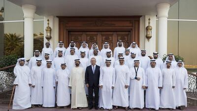 Sheikh Mohammed bin Rashid, Vice President and Ruler of Dubai, Sheikh Mohammed bin Zayed, Crown Prince of Abu Dhabi and Deputy Supreme Commander of the Armed Forces, Sheikh Hamdan bin Mohammed, Crown Prince of Dubai, and Mevlut Cavusoglu, Minister of Foreign Affairs of Turkey, stand for a photograph with Armed Forces servicemen injured while serving the armed forces in Yemen. Seen during a Sea Palace barza. Ryan Carter / Crown Prince Court - Abu Dhabi
