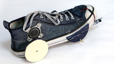 Above, a shoe robot. Junkbot is a do-it-yourself robotic kit where working robots can be created from unwanted junk. Satish Kumar / The National