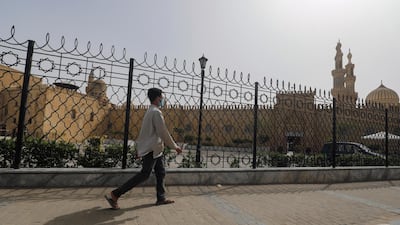 A man walks past the closed Al Azhar Mosque in Cairo which has been closed along with other places of worship to stop the spread of coronavirus in Egypt. Reuters