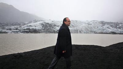 French president Francois Hollande looks at the effects of climate change on the Solheimajokull glacier in Iceland. (Thibault Camus / EPA)