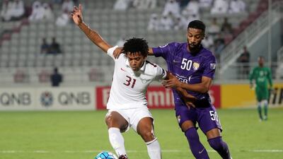 Romarinho, left, seen in action for El Jaish against Al Ain last season, is still likely to play in an Al Jazira shirt next season. Karim Jaafar / AFP