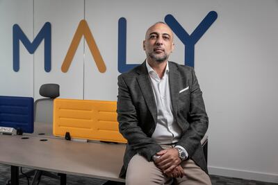 Mo Ibrahim says one of Maly's aims is to help people pay off their debts and start saving. Antonie Robertson / The National