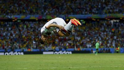 Miroslav Klose does a flip after scoring against Ghana on Saturday for the 2-2 equaliser at the 2014 World Cup in Fortaleza, Brazil. Eddie Keogh / Reuters / June 21, 2014