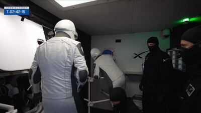 Dr Al Neyadi signs the wall before entering the cockpit