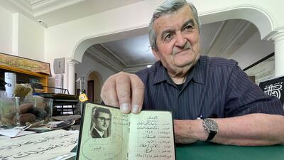 Mr Tabbal shows his work ID from 1968, when he started working at the Jordan Petroleum Refinery Company