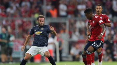 Bayern Munich's David Alaba challenges Manchester United's Juan Mata. Getty Images