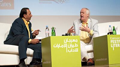 DUBAI, UNITED ARAB EMIRATES - March 4, 2014 - British lyricist and author Sir Tim Rice ® speaks with TV interviewer and reporter Riz Khan (L) at the opening ceremonies of the sixth annual Emirates Airline Festival of Literature at the Dubai Scientific & Cultural Association in Al Mamzar, Dubai City, Dubai March 4, 2014. The festival is being held at the Festival City intercontinental Hotel through March 8. (Photo by Jeff Topping/ For The National)