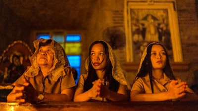 Catholic faithful at the candlelit Missa Aurea, known as the Golden Mass, to mark the fifth pre-dawn mass in anticipation of Christmas at Saint Peter of Alcantara Parish in Pakil, Philippines. Getty Images