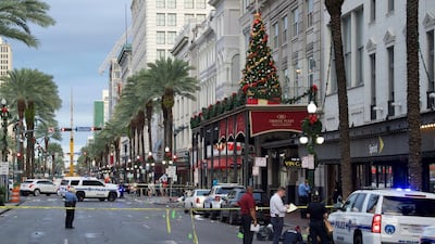 New Orleans police investigate the scene of a shooting Sunday, December 1, 2019, on the edge of the city's famed French Quarter in New Orleans. Max Becherer/The Advocate via AP