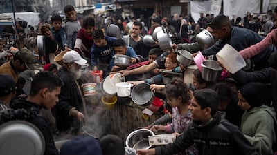 Palestinians line up for a free meal in Rafah, Gaza Strip, Thursday, Dec. 21, 2023. International aid agencies say Gaza is suffering from shortages of food, medicine, and other essential supplies as a result of the two-and-a-half-month war between Israel and Hamas. (AP Photo / Fatima Shbair)