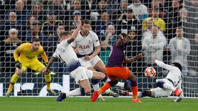 Tottenham's Danny Rose, right, flings himself at a Raheem Sterling shot before the incident is reviewed by VAR. Reuters