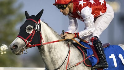 Fabrice Veron rides RB Lam Tara to victory in the Group 3 Al Ruwais Stakes in Abu Dhabi on Sunday. Erika Rasmussen for The National