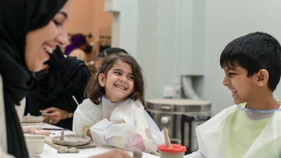 Al Hosani teaches young pupils during a workshop.