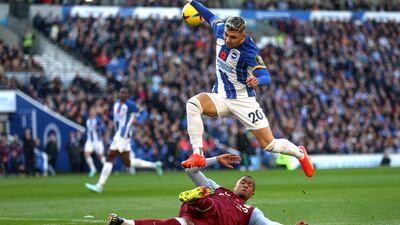 Julio Enciso of Brighton is challenged by Ezri Konsa of Aston Villa. Getty