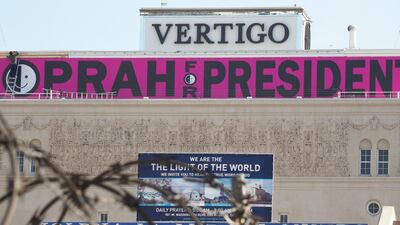 A sign reading "Oprah For President" is seen atop a building in downtown Los Angeles. Robyn Beck / AFP