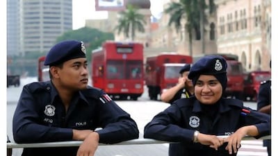 Police cordon off Merdeka square in Kuala Lumpur yesterday on the eve of a mass rally by Bersih 2.0 calling for electoral reform. Saeed Khan / AFP