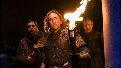 From left, Stephen Campbell Moore, Nicolas Cage and Ron Perlman are charged with transporting a suspected witch to an abbey in Season of the Witch. Relativity Media, Egon Endrenyi / AP Photo