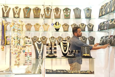 Dileep at his jewellery shop in the Bangladesh pavilion. Pawan Singh for The National
