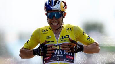Jumbo-Visma's Wout Van Aert celebrates as he crosses the finish. Reuters