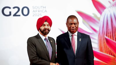 South African Deputy President Paul Mashatile, right, welcomes World Bank President Ajay Banga. AP
