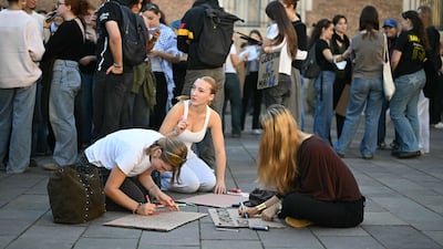 Students prepare placards before a demonstration in Toulouse. AFP