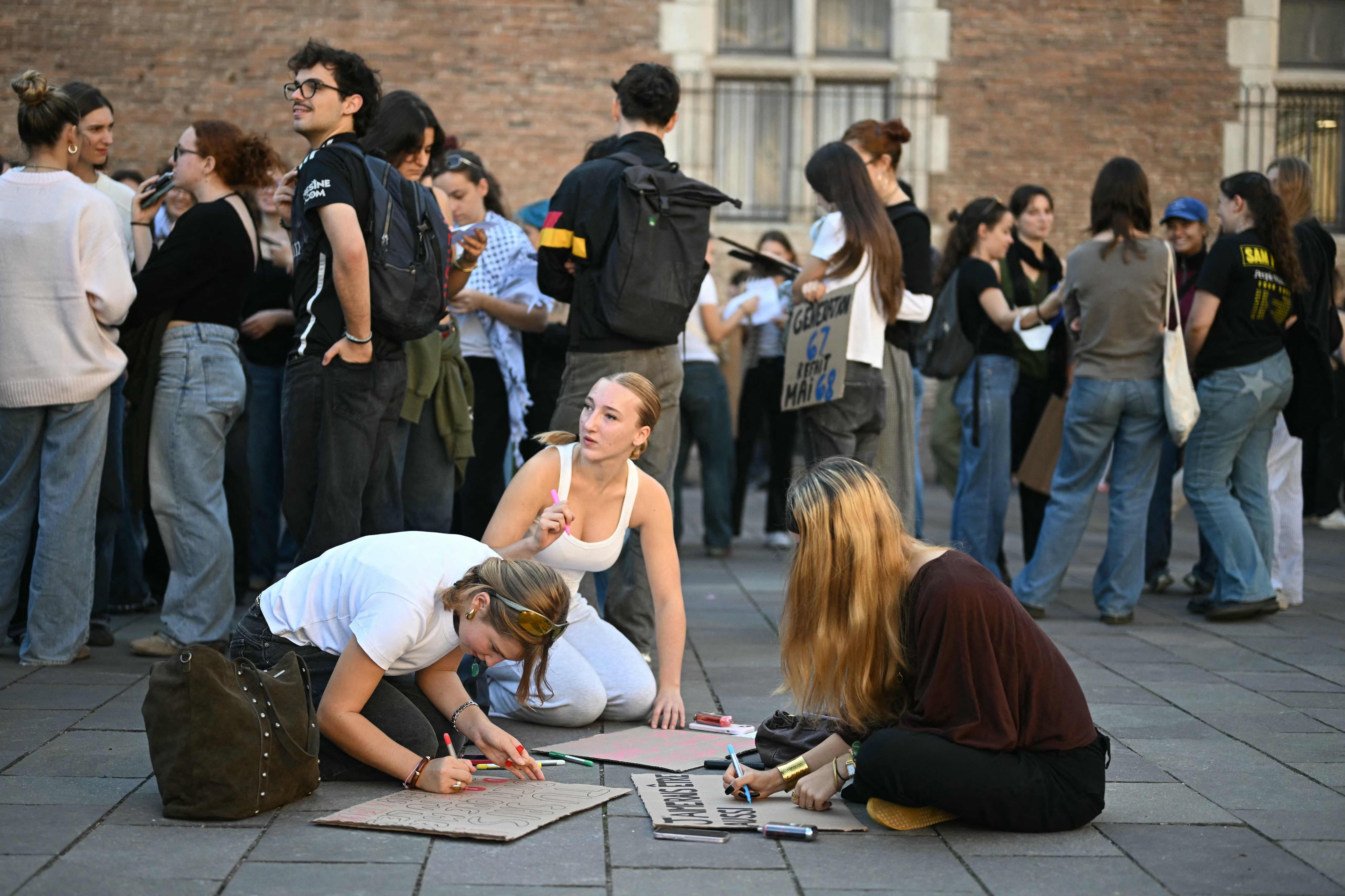 Students prepare placards before a demonstration in Toulouse. AFP