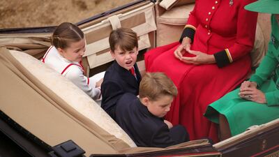 Princess Charlotte, Prince Louis and Prince George arrive by carriage at Horse Guards Parade with Queen Camilla and Catherine, Princess of Wales. Reuters