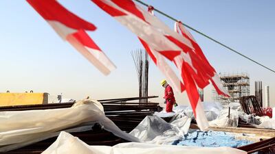 Workers on January 9, 2017, at the construction site of the Al Bayt Stadium, in Doha, one of the venues for the 2022 FIFA World Cup in Qatar. Lars Baron / Bongarts / Getty Images