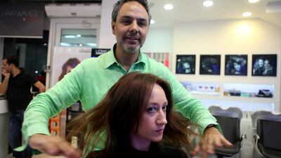 The Lebanese stylist Charbel Doumit styles Sarah Ferguson hair at his salon, Hairwaves, in Abu Dhabi. Sammy Dallal / The National