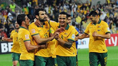Mile Jedinak, second from left, and Tim Cahill, centre, scored for Australia against Kuwait in Melbourne on Friday. Mal Fairclough / AFP