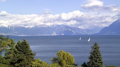 A view of Lake Geneva with the Alps in the background at Lausanne. Boat trips to Evian, France are available.