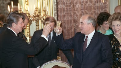 Gorbachev and Reagan share smiles after toasting each other during a dinner hosted at the Soviet embassy in Washington. AFP