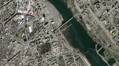 An aerial view of the second of Mosul's five destroyed bridges across the Tigris River, captured on February 19, 2017. Distribution Airbus DS / CNES / AFP