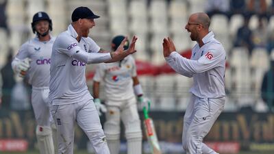 England spinner Jack Leach and captain Ben Stokes celebrate the dismissal of Mohammad Rizwan. Reuters